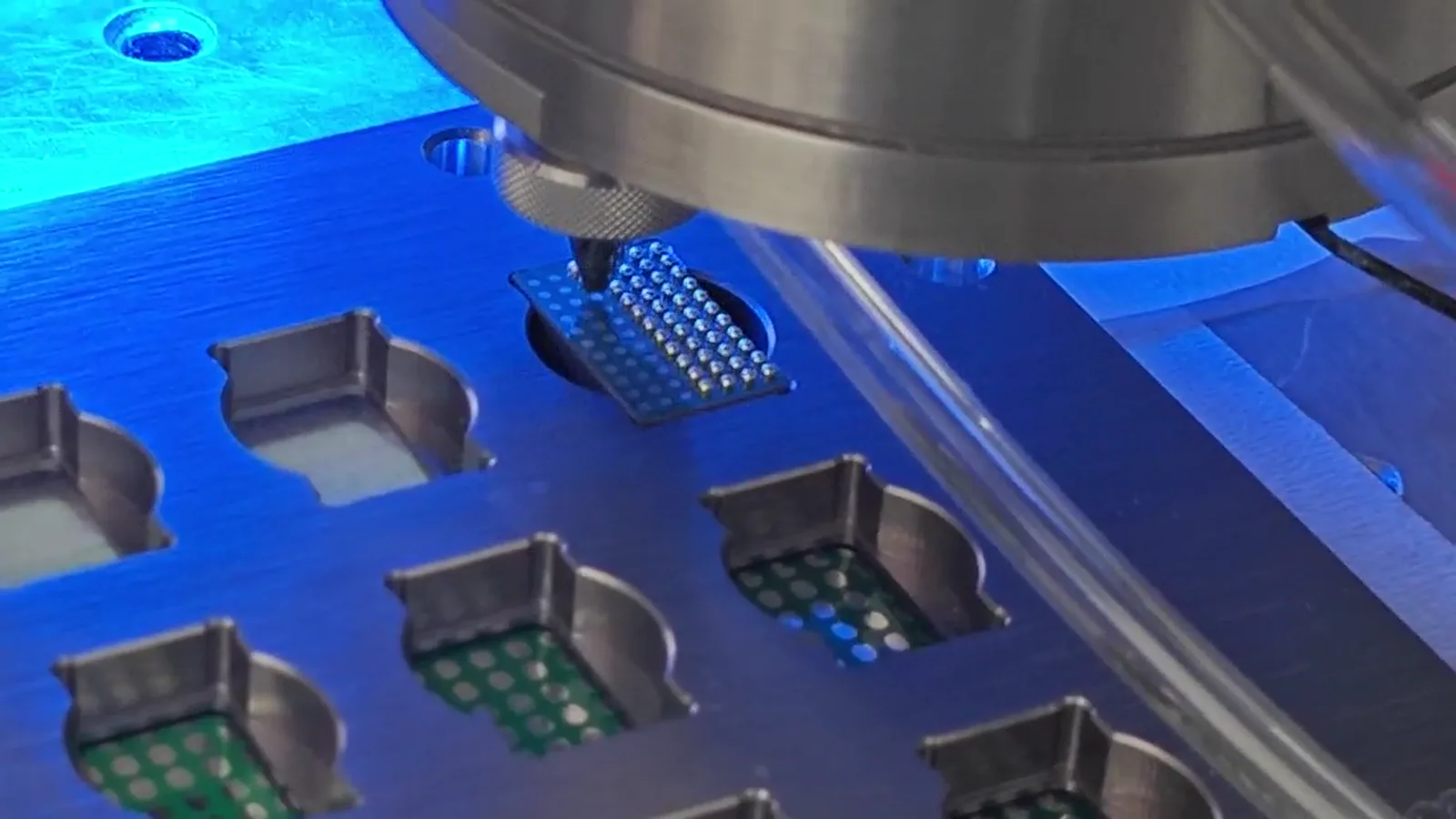 Supplied close-up of a jetting head over supported electronic test positions