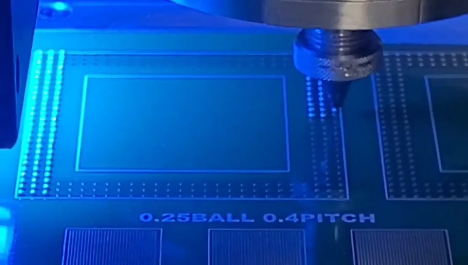 Supplied localized soldering frame showing a process head above a marked test pattern